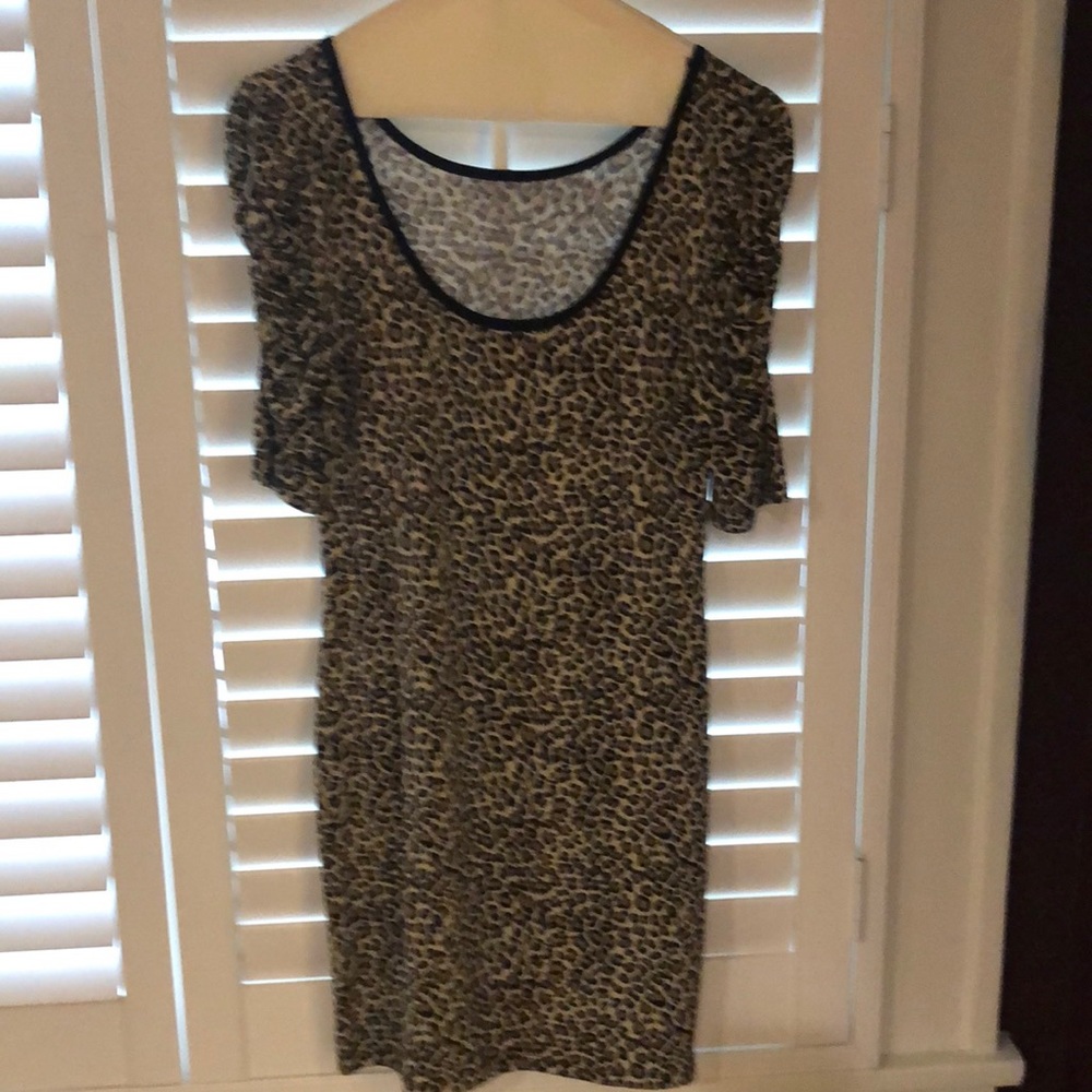 Cheetah dress with rouged sleeves.